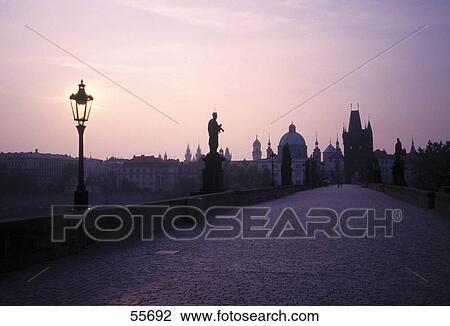 Stock Image - Bridge at sunrise, Charles Bridge, Vltava River, Prague, Czech Republic . Fotosearch