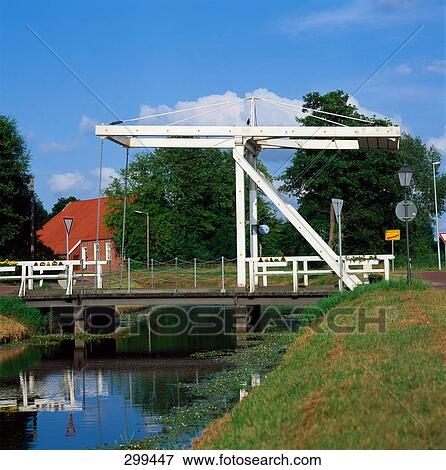 Stock Photo - Bridge on canal, Lower Saxony, Germany . Fotosearch