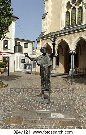 Bronze statue in front of parish church St. Nikolai, Villach, Carinthia, Austria View Large Photo Image Stock Image - Bronze statue in front of parish church St. Nikolai, Villach, Carinthia, Austria . Fotosearch