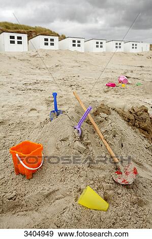 Buckets and blades on the beach of Texel, Netherlands View Large Photo Image Stock Photo - Buckets and blades on the beach of Texel, Netherlands . Fotosearch