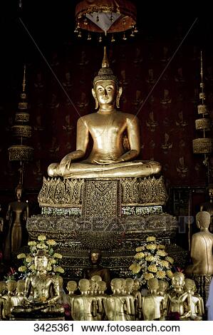 Stock Image - Buddha sculptures in a temple, Bangkok, Thailand . Fotosearch
