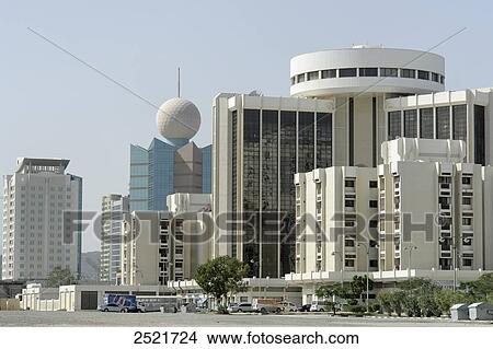 Picture - Buildings at roadside, Fujairah, United Arab Emirates . Fotosearch