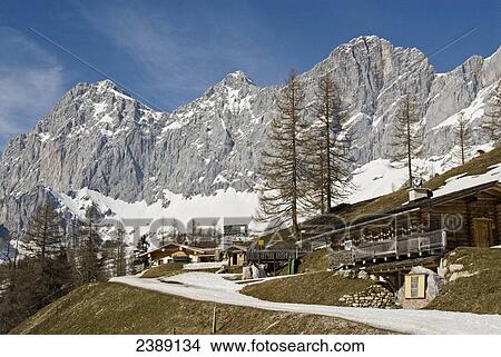 Buildings in front of mountain range, Dachstein Mountains, Ramsau am Dachstein, Liezen, Styria, Austria View Large Photo Image Picture - Buildings in front of mountain range, Dachstein Mountains, Ramsau am Dachstein, Liezen, Styria, Austria . Fotosearch