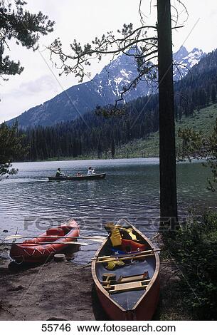Stock Photograph - Canoe at lakeside, String Lake, Grand Teton National Park, Wyoming, USA . Fotosearch