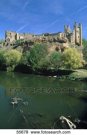 Stock Photo - Castle at waterfront, Templar Castle, Valencia De Don Juan, Leon, Spain . Fotosearch