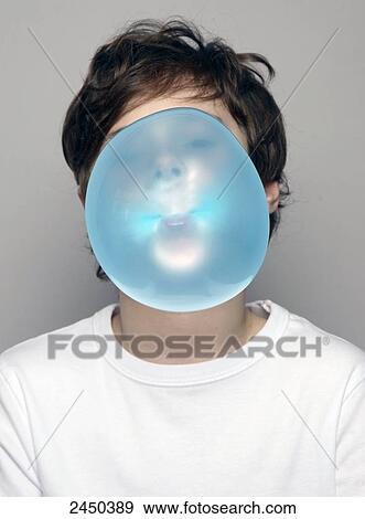 Stock Photo - Close-up of boy blowing chewing gum . Fotosearch