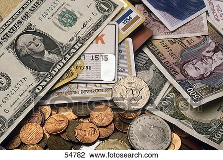 Stock Image - Close-up of currencies and credit cards . Fotosearch