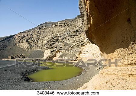 Crater and craterlake Charco de los Clicos, El Golfo, Lanzarote, Spain View Large Photo Image Stock Photograph - Crater and craterlake Charco de los Clicos, El Golfo, Lanzarote, Spain . Fotosearch