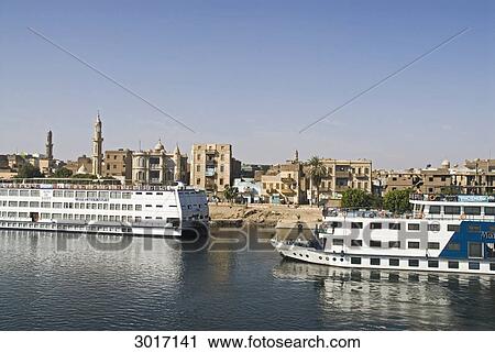 Stock Image - Cruise ships at the bank of the Nile, Esna, Egypt . Fotosearch
