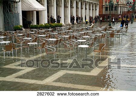 Empty chairs at sidewalk cafe in rain, St. Marks Square, Venice, Veneto, Italy View Large Photo Image Stock Image - Empty chairs at sidewalk cafe in rain, St. Marks Square, Venice, Veneto, Italy . Fotosearch