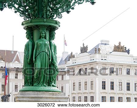 Figures on a lantern, castle in the background, Prague, Czech Republic View Large Photo Image Stock Image - Figures on a lantern, castle in the background, Prague, Czech Republic . Fotosearch