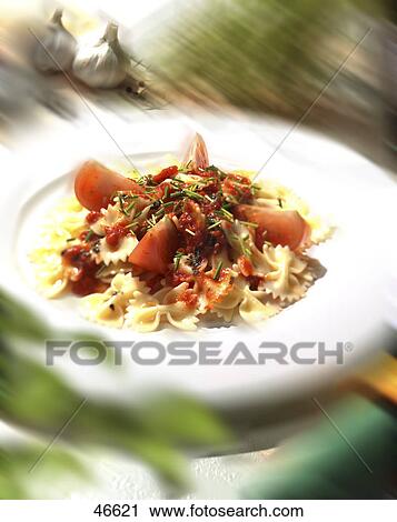 Stock Image - fish and pasta, blurred . Fotosearch