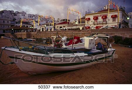 Fishing boat on beach, Albufeira, Algarve, Portugal View Large Photo Image Stock Photo - Fishing boat on beach, Albufeira, Algarve, Portugal . Fotosearch