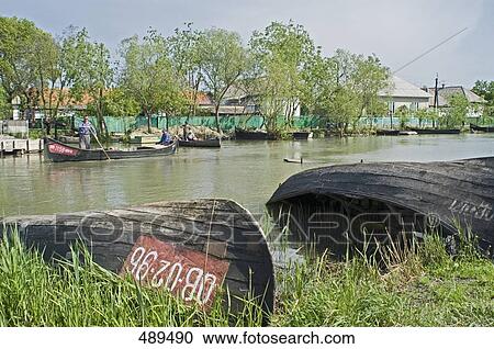 Stock Image - Fishing boats in river, Vylkove, Kiliyskyi Raion, Odessa Oblast, Ukraine . Fotosearch