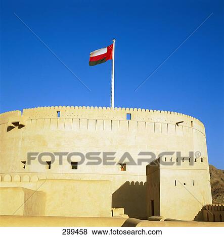 Flag of Oman on top of fort, Nizwa, Oman View Large Photo Image Stock Photo - Flag of Oman on top of fort, Nizwa, Oman . Fotosearch
