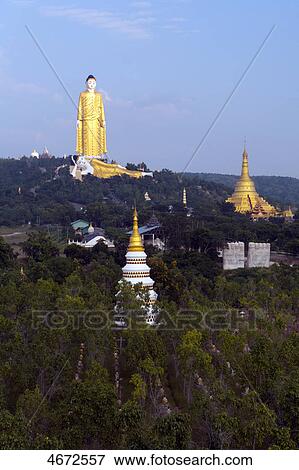 Giant standing and reclining Buddha, Monywa, Myanmar View Large Photo Image Stock Photo - Giant standing and reclining Buddha, Monywa, Myanmar . Fotosearch