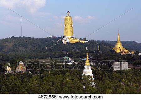 Giant standing and reclining Buddha, Monywa, Myanmar View Large Photo Image Stock Photograph - Giant standing and reclining Buddha, Monywa, Myanmar . Fotosearch