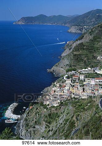 Picture - High angle view of a town at the coast, Riomaggiore, Italy . Fotosearch