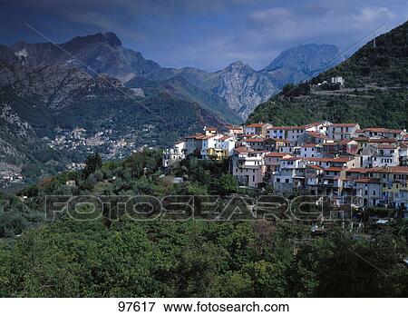High angle view of a village with mountains in the background, Versilia, Tuscany, Italy View Large Photo Image Stock Photo - High angle view of a village with mountains in the background, Versilia, Tuscany, Italy . Fotosearch