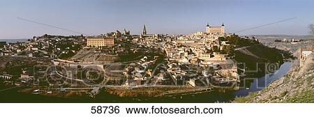 Stock Photograph - High angle view of buildings at waterfront, Toledo, Spain . Fotosearch