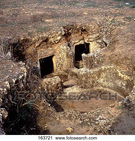 Stock Image - High angle view of chamber graves, Anghelu Ruiu, Sardinia, Italy . Fotosearch
