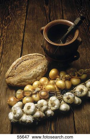 High angle view of garlic and loaf of bead View Large Photo Image Stock Photo - High angle view of garlic and loaf of bead . Fotosearch