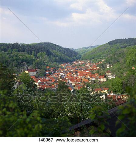 High angle view of houses surrounded by forest, Thuringia, Germany View Large Photo Image Stock Photo - High angle view of houses surrounded by forest, Thuringia, Germany . Fotosearch