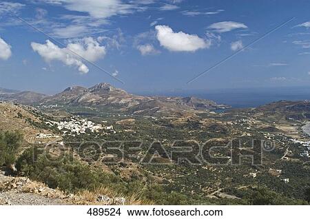 High angle view of village in valley, Plakias, Crete, Greece View Large Photo Image Picture - High angle view of village in valley, Plakias, Crete, Greece . Fotosearch