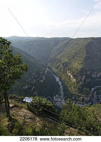 High angle view of village in valley, Saint-Chely-du-Tarn, Lozere, Languedoc-Roussillon, France View Large Photo Image Stock Photo - High angle view of village in valley, Saint-Chely-du-Tarn, Lozere, Languedoc-Roussillon, France . Fotosearch