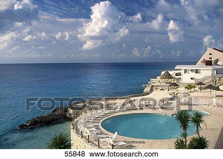 Stock Photo - Hotel with swimming pool on beach, Cozumel, Yucatan, Mexico . Fotosearch