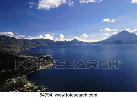 Lake surrounded by mountains, Lake Atitlan, Guatemala View Large Photo Image Picture - Lake surrounded by mountains, Lake Atitlan, Guatemala . Fotosearch