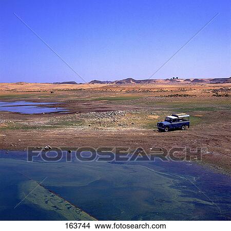 Picture - Land vehicle on lakeside, Wadi Halfa, Lake Nubia, Sudan . Fotosearch