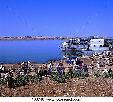 Large group of people near a passenger boat, Lake Nasser, Wadi Halfa, Nubien Sudan View Large Photo Image Stock Photograph - Large group of people near a passenger boat, Lake Nasser, Wadi Halfa, Nubien Sudan . Fotosearch