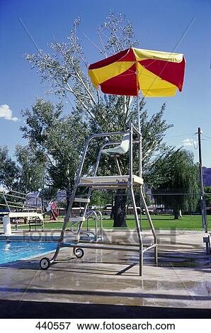 Lifeguard chair at poolside View Large Photo Image Stock Photo - Lifeguard chair at poolside . Fotosearch