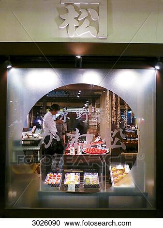 Stock Image - Looking through a window into a store, Kyoto, Japan . Fotosearch