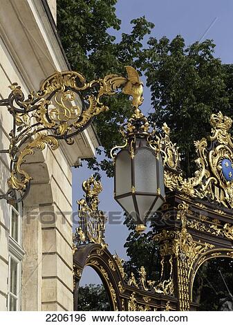 Stock Photograph - Low angle view of lantern with golden gate, Place Stanislas, Nancy, Meurthe-et-Moselle, Lorraine, France . Fotosearch