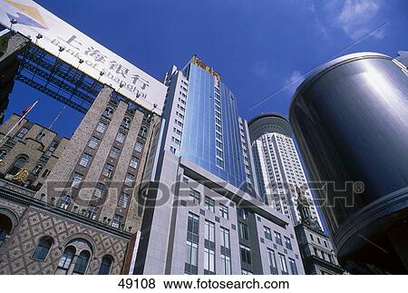 Stock Photo - Low angle view of office buildings, Shanghai, China . Fotosearch