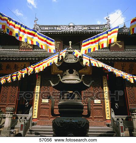 Low angle view of prayer flags in front of temple, Jade Buddha Temple, Shanghai, China, Asia View Large Photo Image Stock Photograph - Low angle view of prayer flags in front of temple, Jade Buddha Temple, Shanghai, China, Asia . Fotosearch