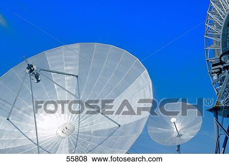 Low angle view of telecommunications satellite dishes View Large Photo Image Stock Photo - Low angle view of telecommunications satellite dishes . Fotosearch