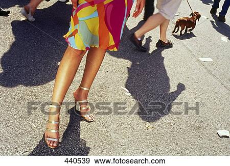 Low section view of woman standing on road View Large Photo Image Stock Photo - Low section view of woman standing on road . Fotosearch
