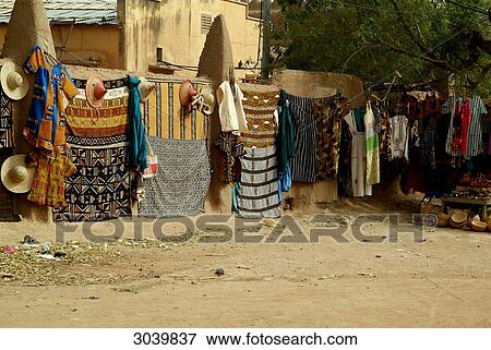 Stock Photo - Market stall with coloured fabrics at the city of Djenne, Mali . Fotosearch