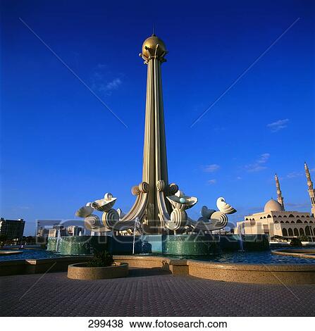 Monument against blue sky in city, King Faisal Mosque, Sharjah, UNITED ARAB EMIRATES View Large Photo Image Stock Photo - Monument against blue sky in city, King Faisal Mosque, Sharjah, UNITED ARAB EMIRATES . Fotosearch