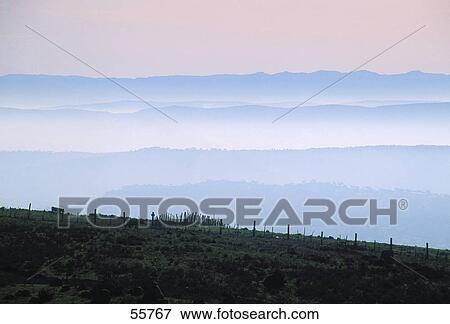 Mountain range surrounding by fog at dawn, Sierra Morena, Jaen province, Andalusia, Spain View Large Photo Image Stock Photo - Mountain range surrounding by fog at dawn, Sierra Morena, Jaen province, Andalusia, Spain . Fotosearch
