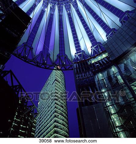 Stock Photo - Office buildings lit up at night, Potsdamer Platz, Berlin, Germany . Fotosearch