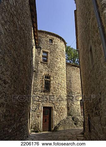 Old buildings on both sides of alley, Saint Chely du Tarn, France View Large Photo Image Stock Photograph - Old buildings on both sides of alley, Saint Chely du Tarn, France . Fotosearch