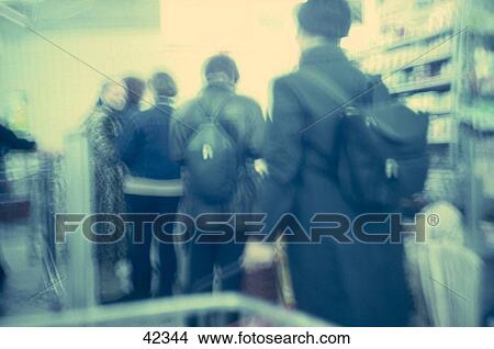 Picture - People inside a shopping center . Fotosearch