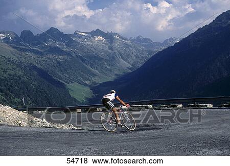 Person riding bicycle, Aran Valley, Lleida, Lerida Province, Catalonia, Spain View Large Photo Image Stock Photo - Person riding bicycle, Aran Valley, Lleida, Lerida Province, Catalonia, Spain . Fotosearch