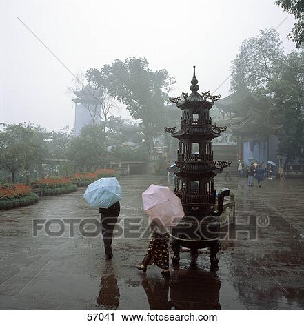 Rear view of group of people holding umbrellas, Fengdu, China, Asia View Large Photo Image Stock Image - Rear view of group of people holding umbrellas, Fengdu, China, Asia . Fotosearch