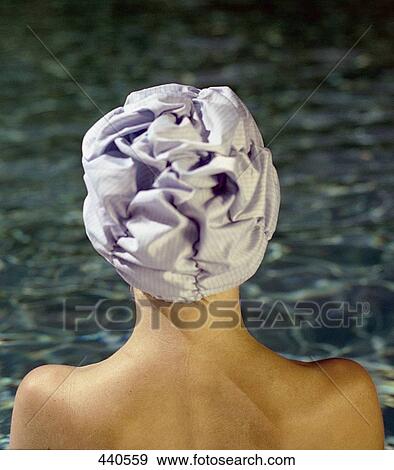 Rear view of woman wearing bathing cap View Large Photo Image Stock Photo - Rear view of woman wearing bathing cap . Fotosearch