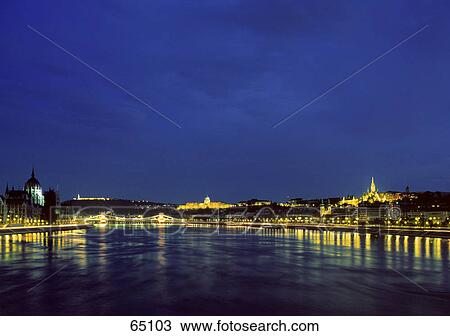 Reflection of lit buildings in river, Danubia River, Budapest, Hungary View Large Photo Image Stock Image - Reflection of lit buildings in river, Danubia River, Budapest, Hungary . Fotosearch